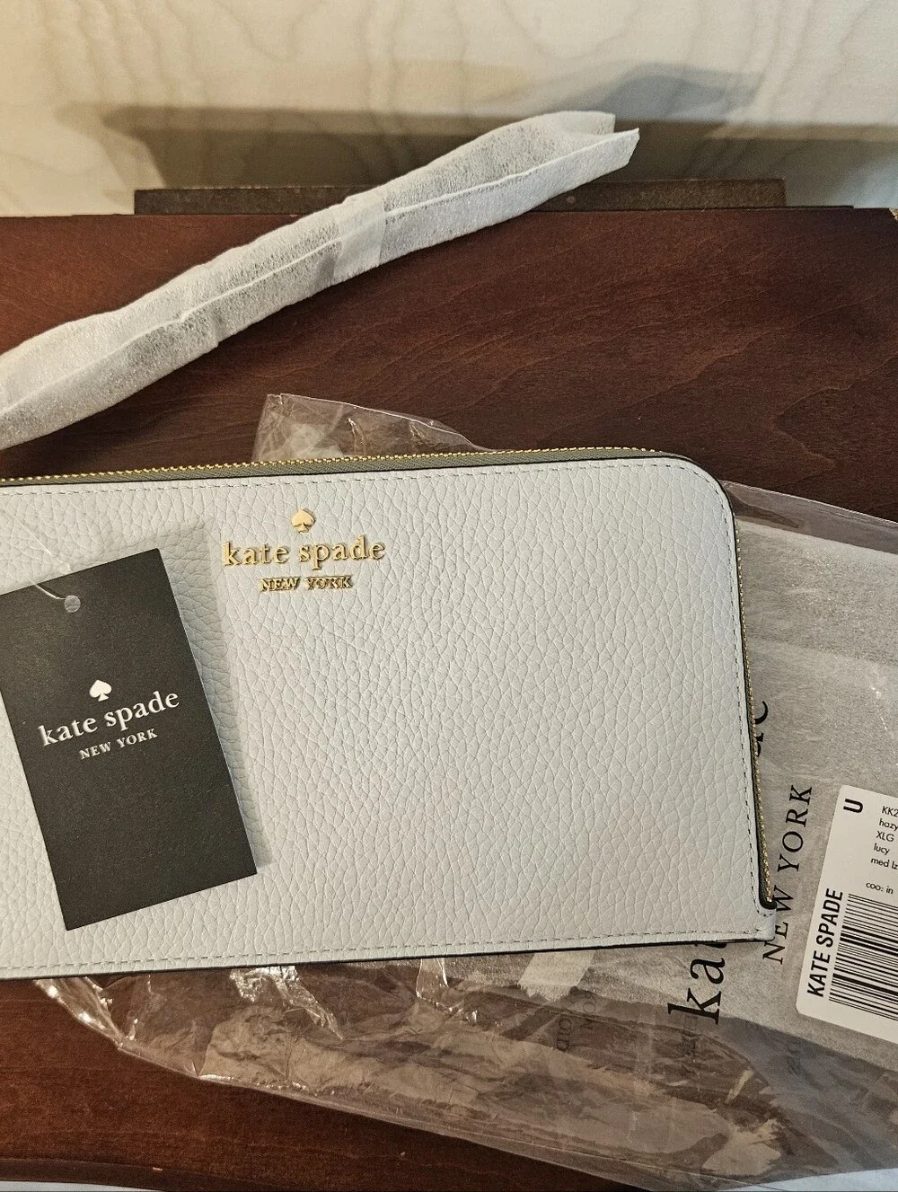 kate spade Pebbled Zip-Around Wallet in Light Blue with Gold Hardware